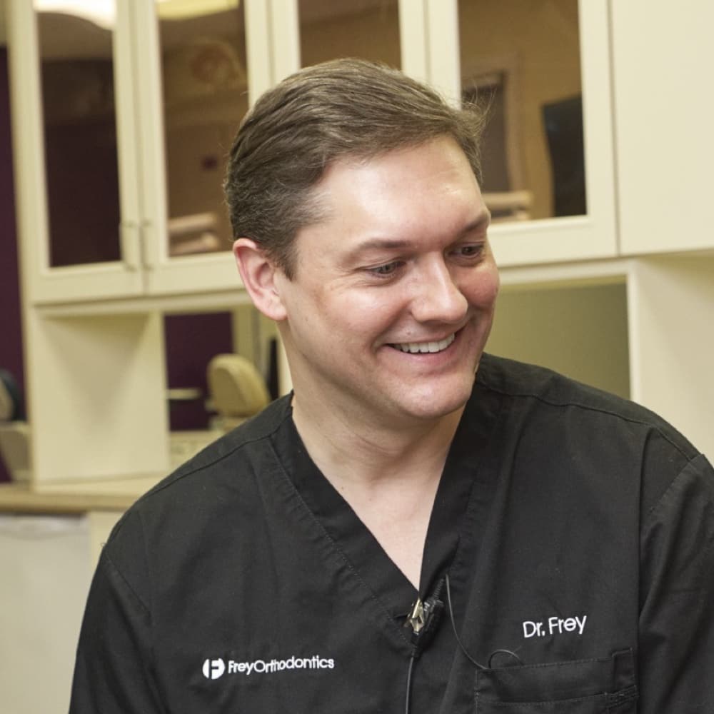 Dr. Frey smiling with patient